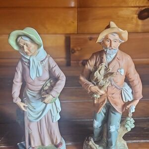 Pair of Painted Multicolor Porcelain Figurines Rustic Man and Woman with Baskets